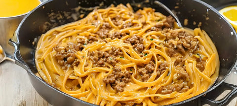 Pasta with meat sauce served in a gourmet dish, featuring veal and black truffle butter