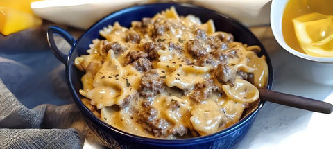 Bow tie pasta with savory meat sauce in a creamy truffle dish.