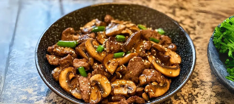 Beef and mushroom stir-fry with gourmet black pepper and truffle sauce.