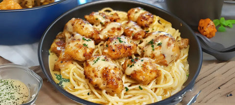 Delicious Chicken and Spaghetti dish featuring White Truffle Butter and Creamy Parmesan.