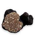 Slice of fresh Bagnoli truffle Tuber Mesentericum with white veining