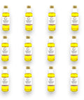 Yellow olive oil bottles with white labels and gold caps for White Truffle Extra Virgin Olive Oil